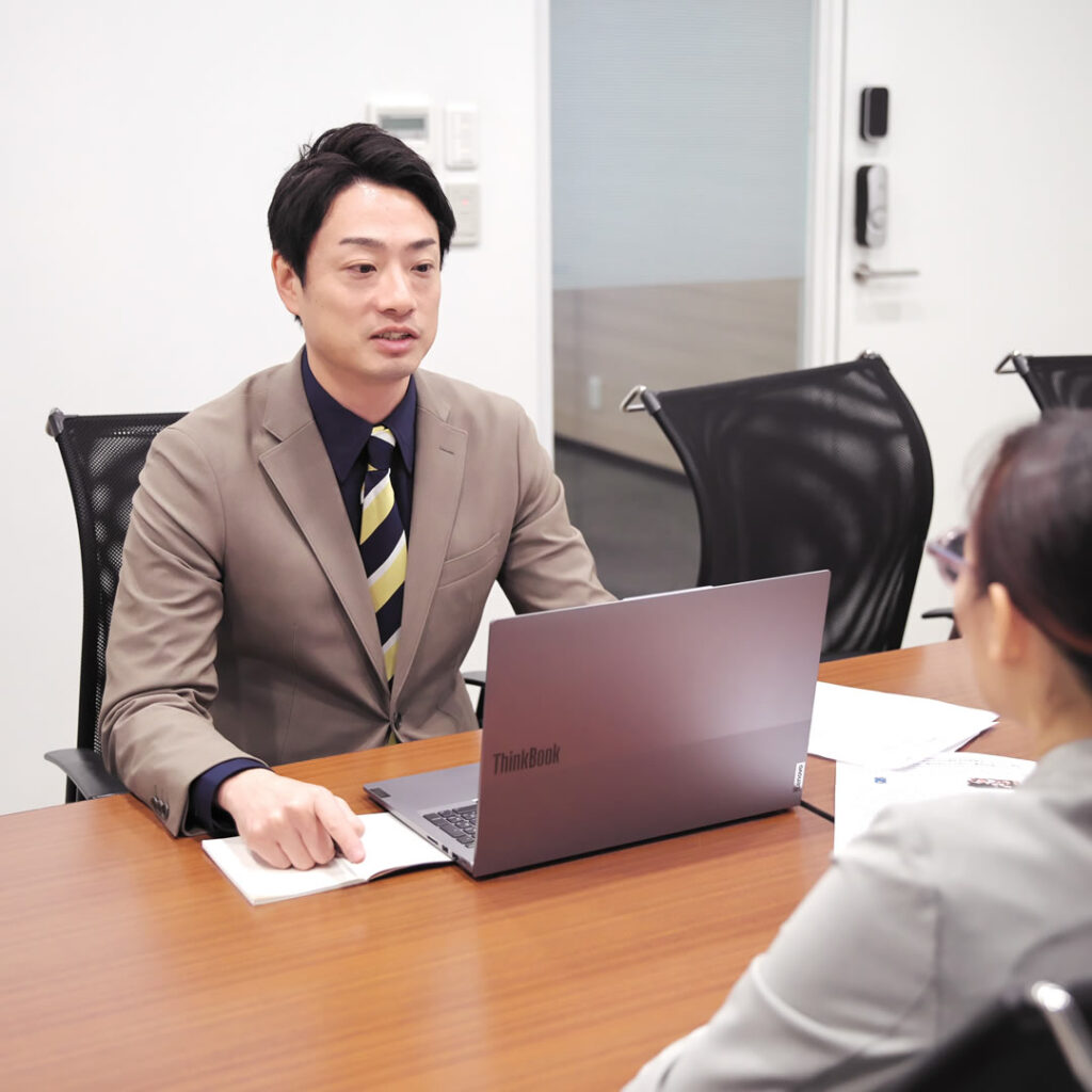 商談をしている田中代表